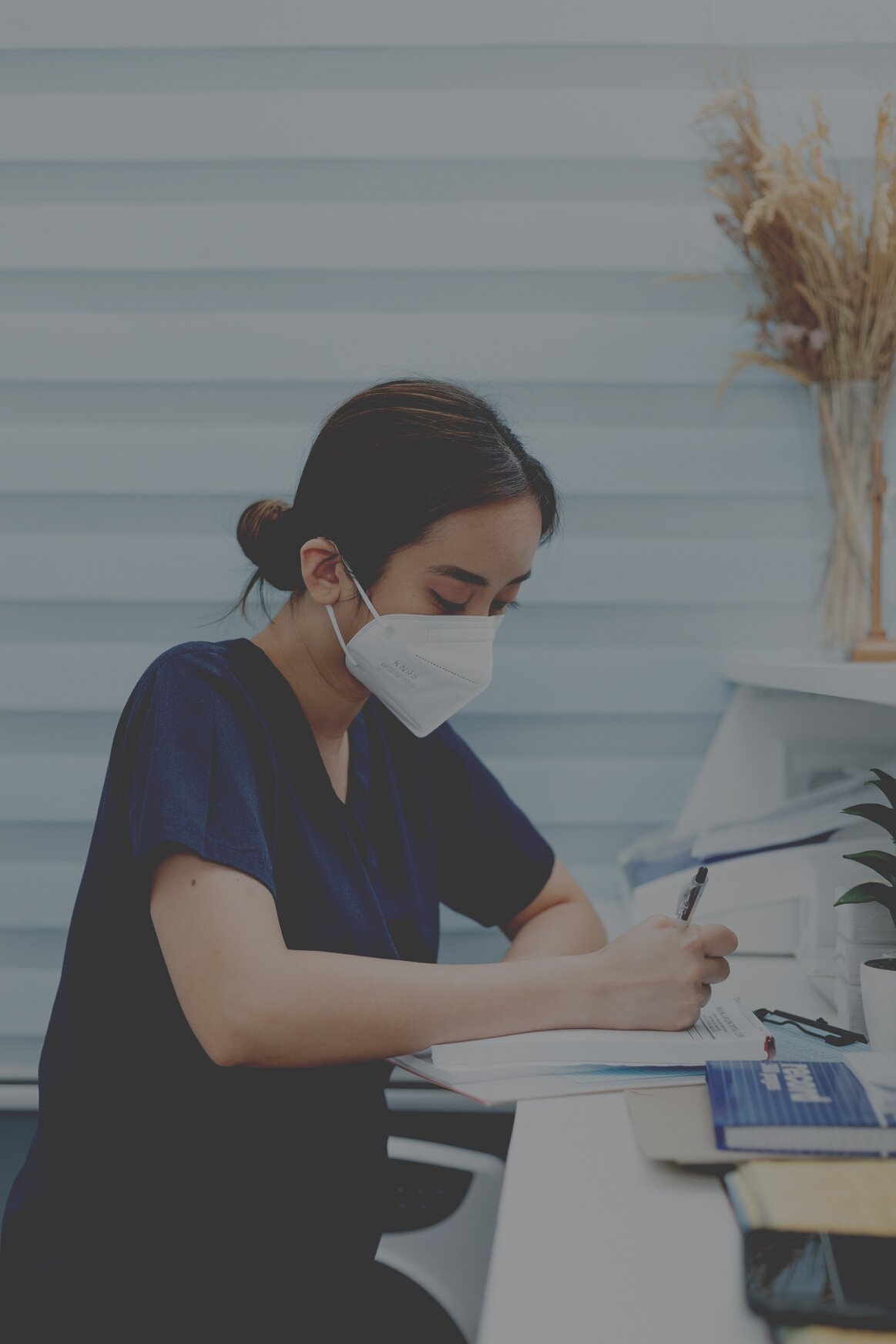 Doctor Working on Clinic Desk